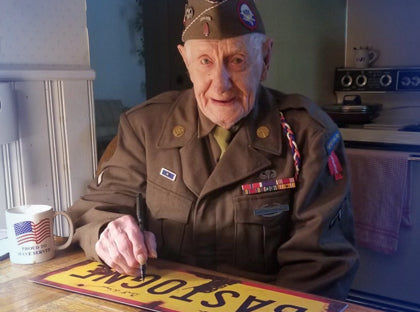 Autographed World War II metal signs 