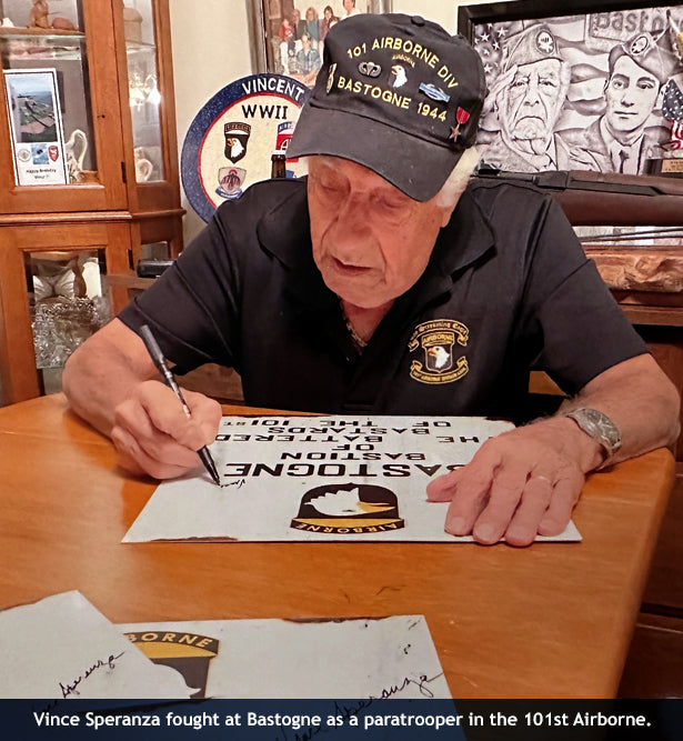 101st Airborne paratrooper Vince Speranza with Bastogne sign