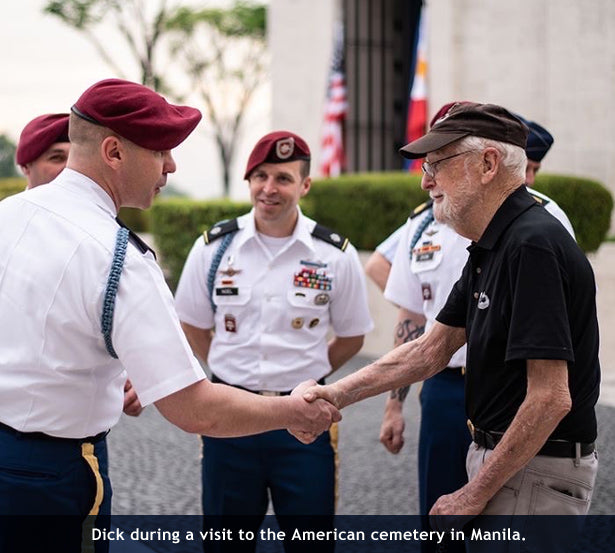 Dick Adams greets 173rd Airborne paratroopers