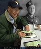 Brad Freeman autographing Dick Winters photos